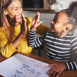 Learning to calculate, high five success, black mother and child