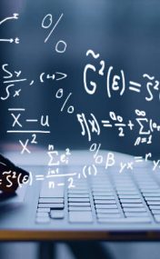 Hands using laptop with mathematical formulas. Online education concept