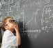 Shot of an academically gifted young girl solving a math equation
