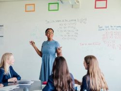 Female teacher discussing STEM: Mathematics during class.